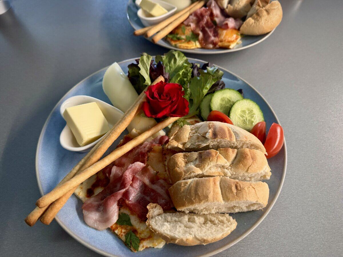 Breakfast at Vila Garufa - bacon, bread, vegetables