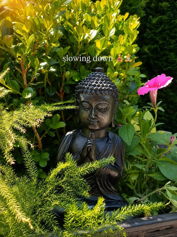Buddha statue among greenery in the Vila Garufa garden