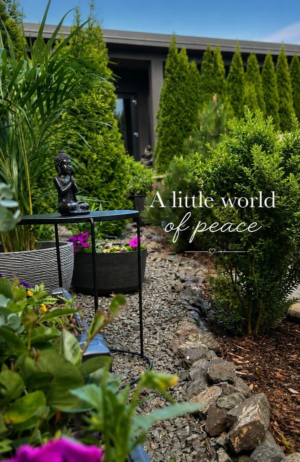 Vila Garufa garden with a Buddha statue, flowers and a gravel path