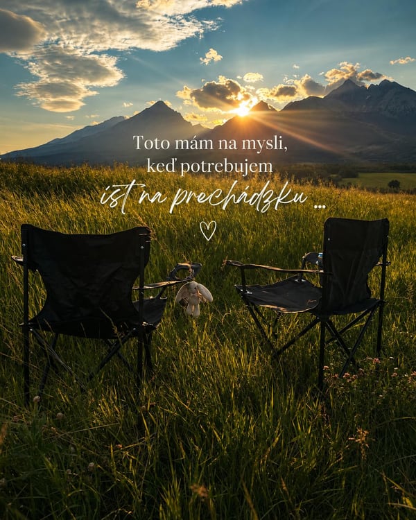 Sunset over the High Tatras with two chairs in a meadow
