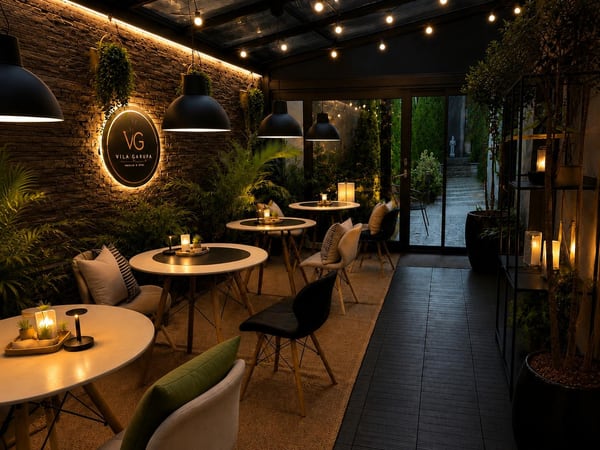 Vila Garufa café & wine terrace with evening lighting and seating
